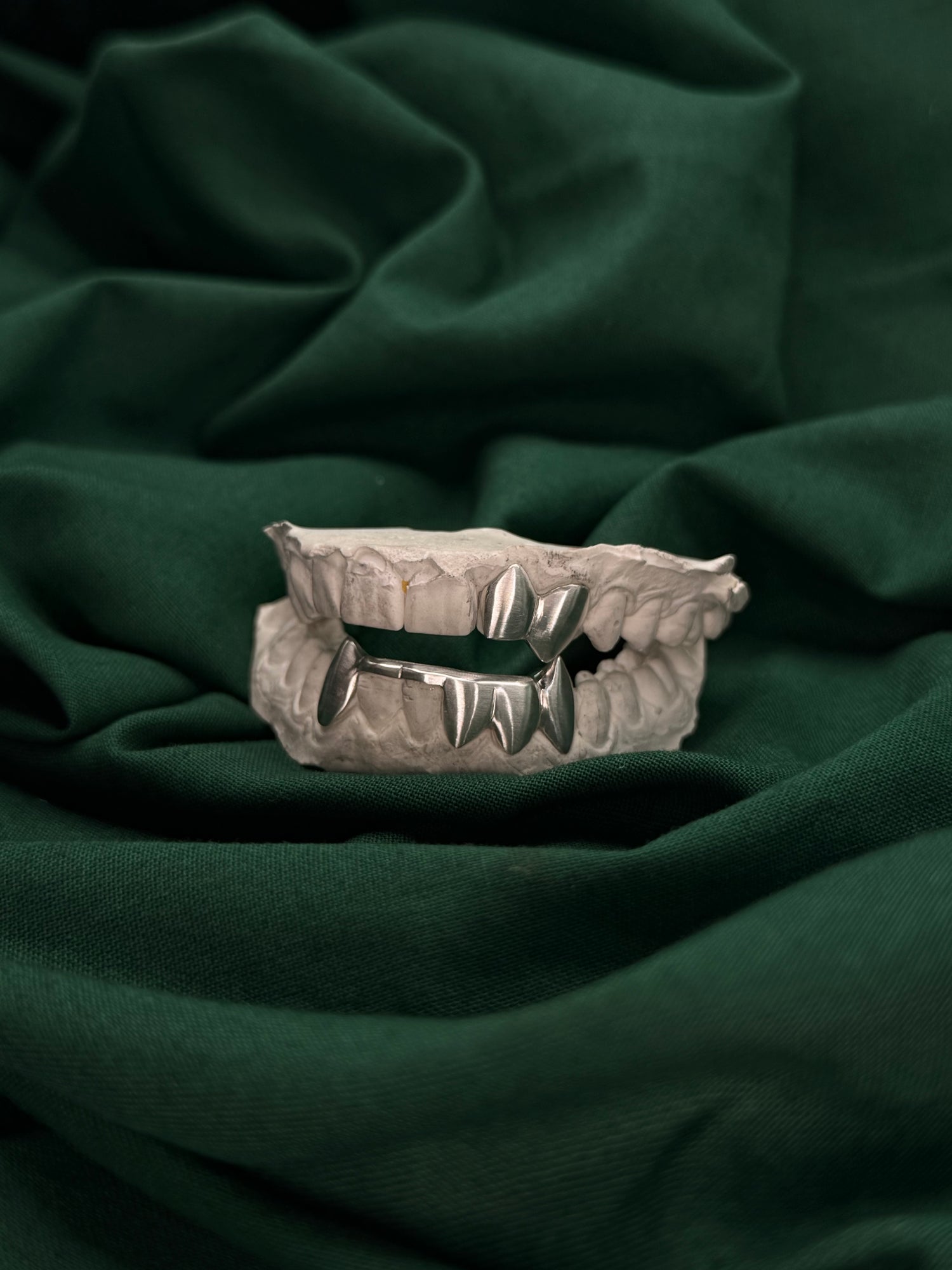 Custom top and bottom grillz in matte finish by Green Skull Grillz