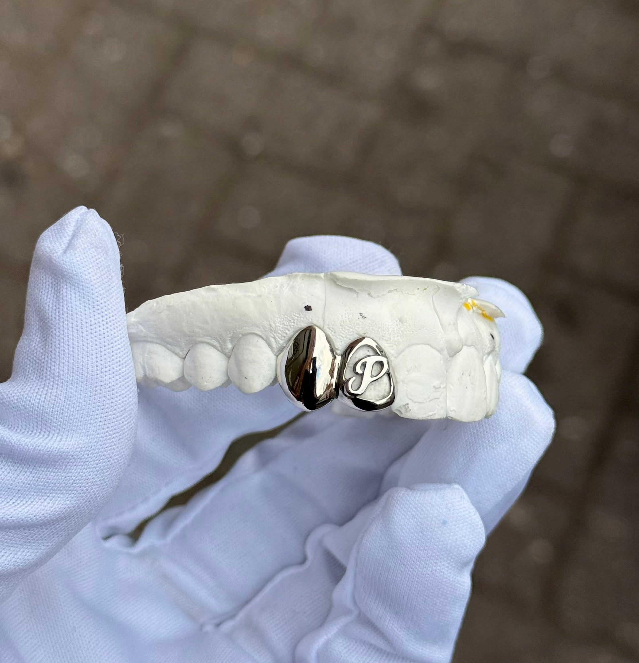 Custom sterling silver letter grillz made to fit your smile